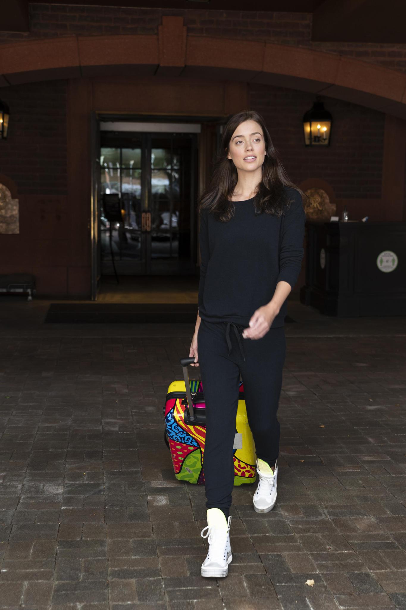 Model wearing the Cozy Banded Joggers in black, relaxed fit, tapered leg, and adjustable drawstring waist, paired with matching long sleeve top.