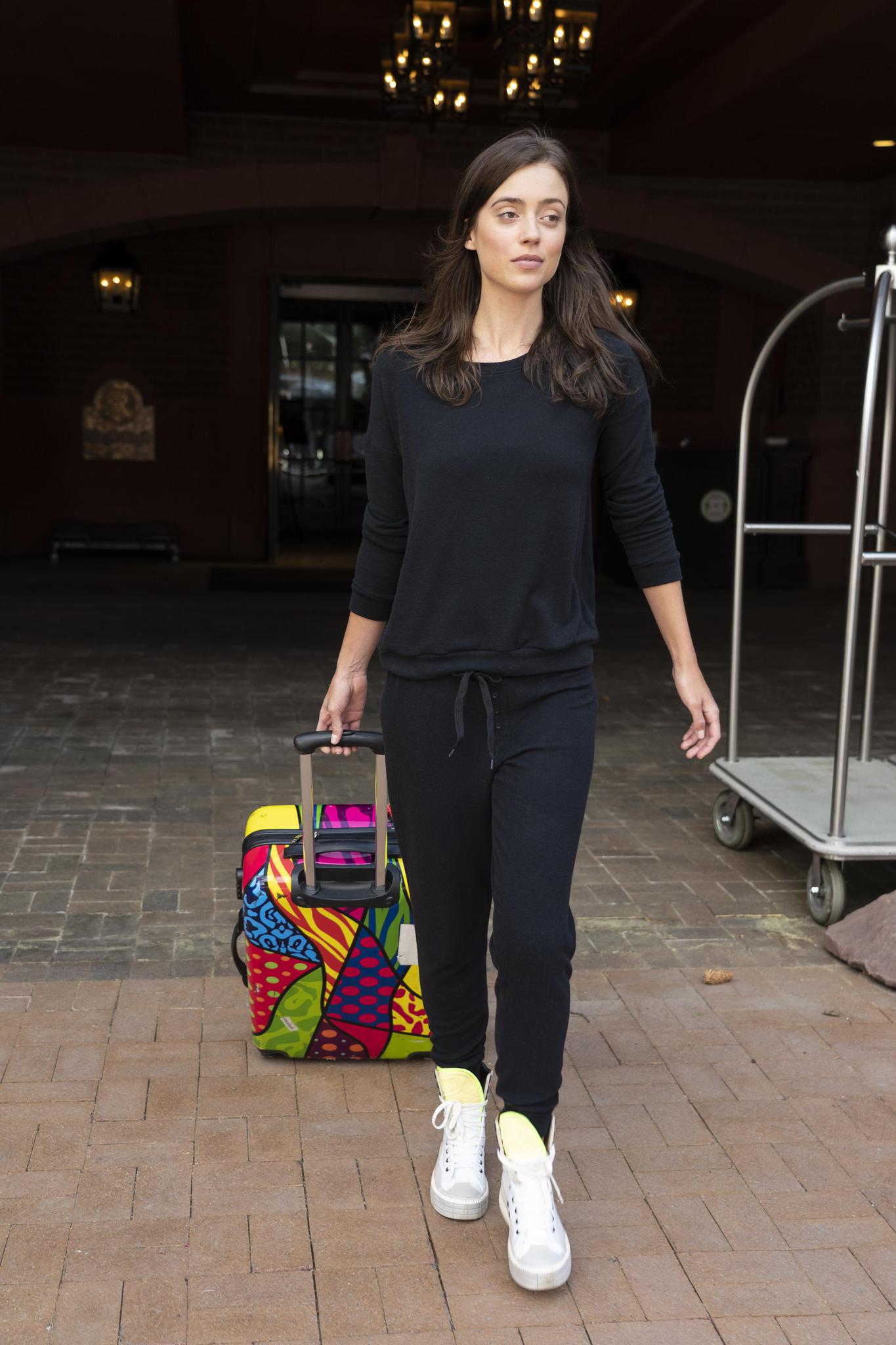 Model wearing the Cozy Banded Joggers in black, relaxed fit, tapered leg, and adjustable drawstring waist, paired with matching long sleeve top.