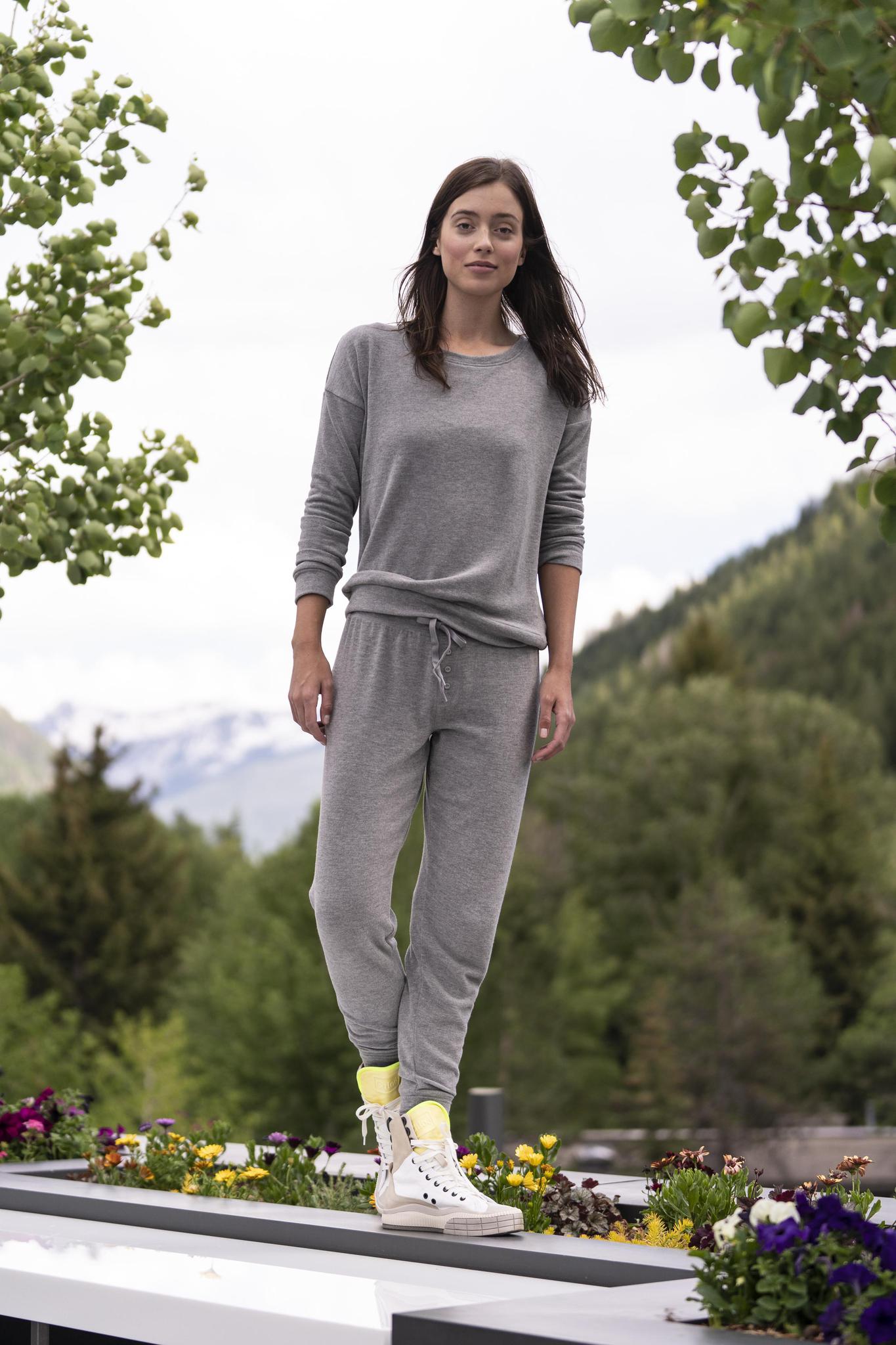 Model wearing the Cozy Banded Joggers in Heather Gray, relaxed fit, banded cuffs, and adjustable drawstring waist, paired with matching cozy long sleeve top
