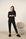Model wearing Cozy Long Pajama Set in black with joggers and long-sleeve crew neck top