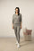 Model wearing Cozy Long Pajama Set in heather gray with crew neck top and relaxed jogger pants.