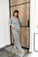 Model wearing heather gray pajama set with V-neck long sleeve top and wide-leg pants