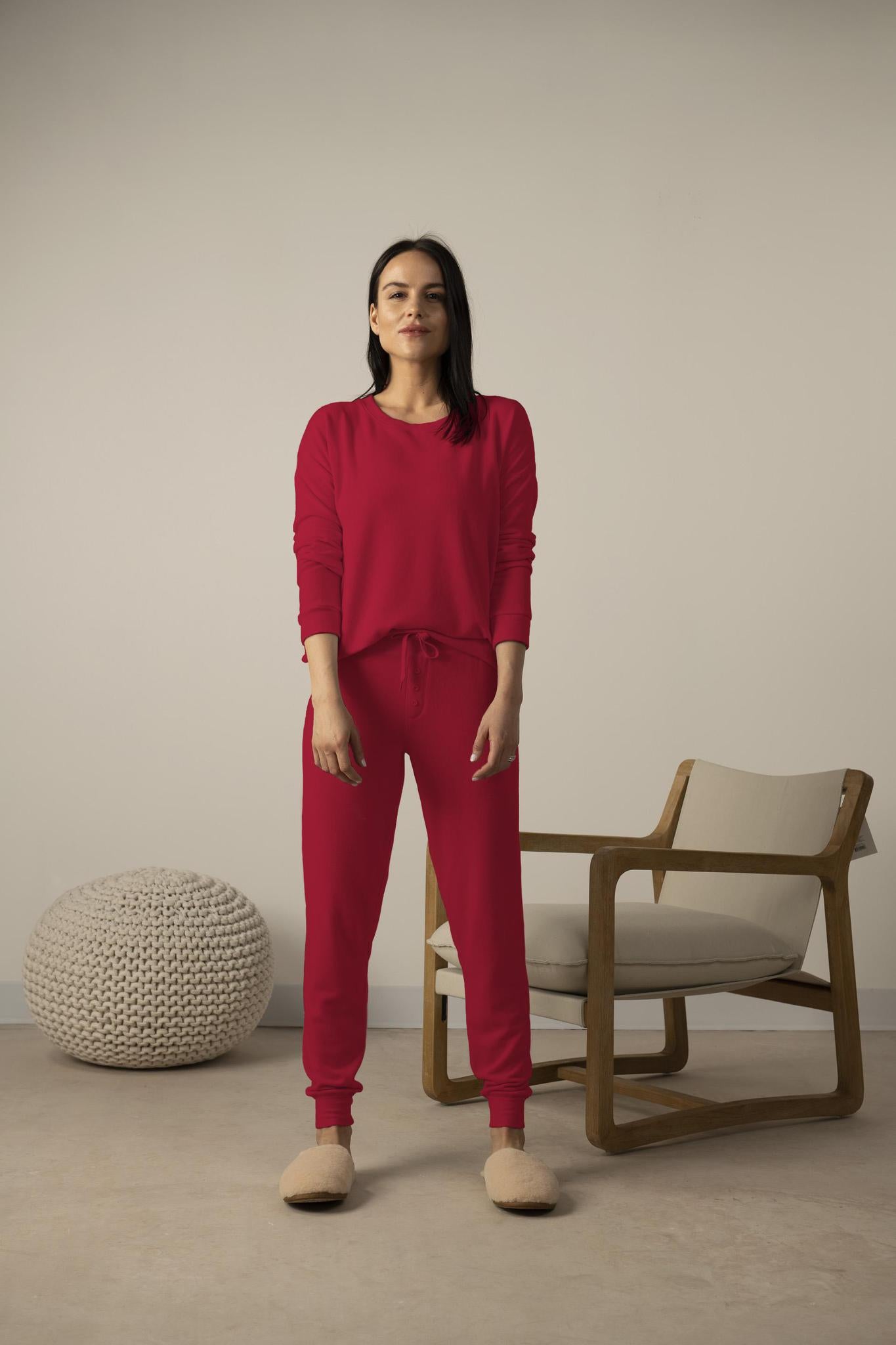 Model wearing red cozy long sleeve top from Aspen Dream with relaxed fit and soft bamboo fabric