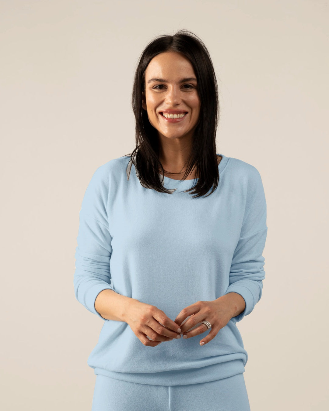 Model wearing Morning Blue cozy long sleeve top with relaxed fit and crew neckline