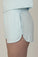 Side view of Hang Out Track Shorts in Ice Blue showing soft bamboo fabric and side pockets.