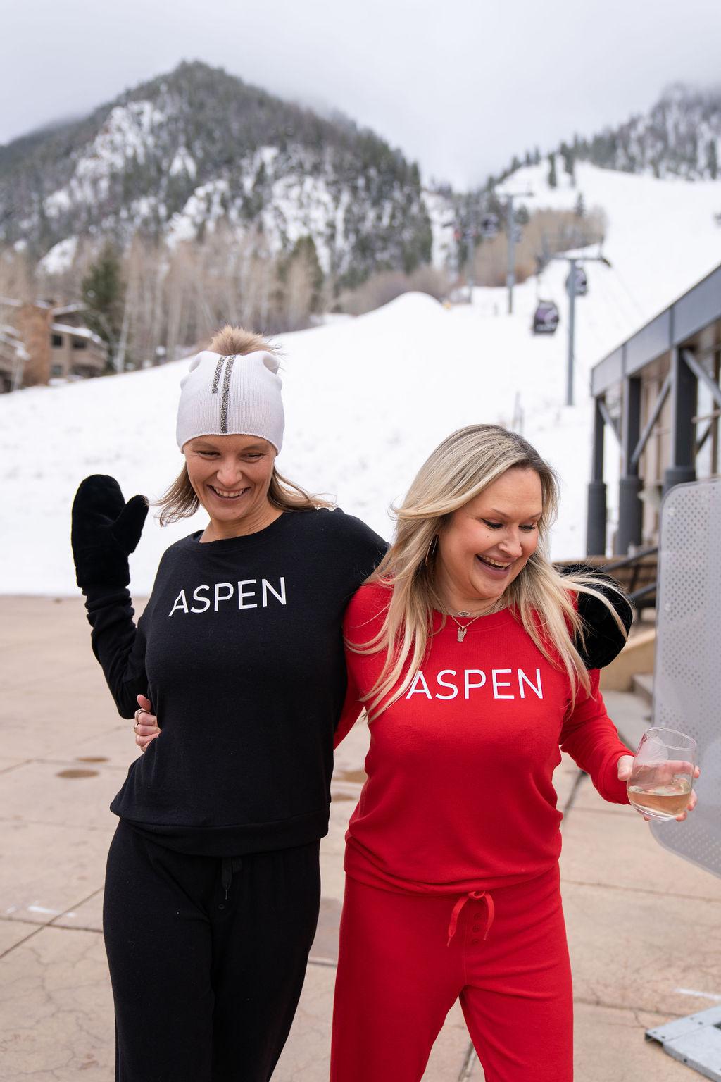 Models wearing red and black long sleeve bamboo tops with relaxed fit from Aspen Dream’s cozy collection