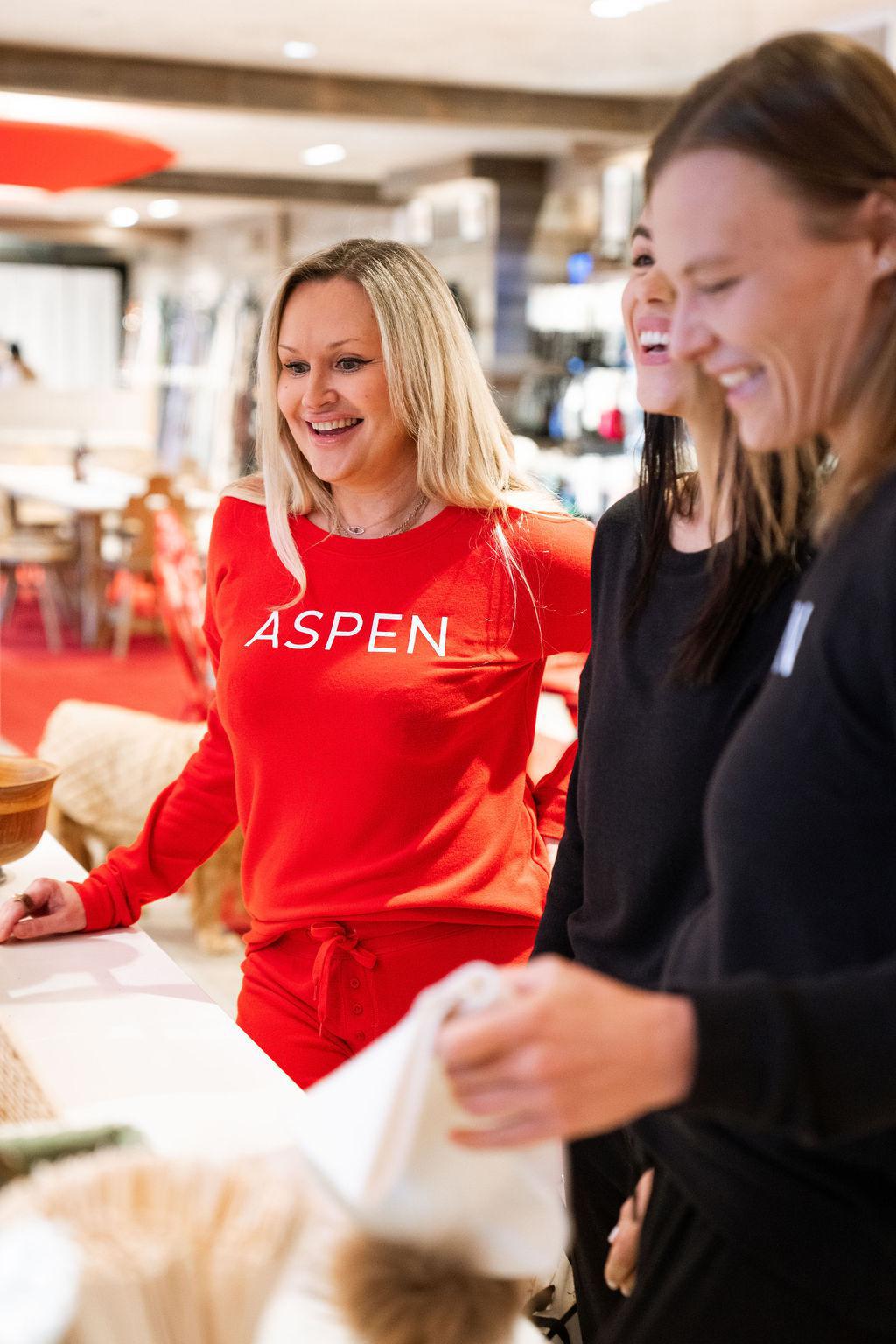 Model wearing red long sleeve bamboo top with relaxed fit from Aspen Dream’s cozy collection