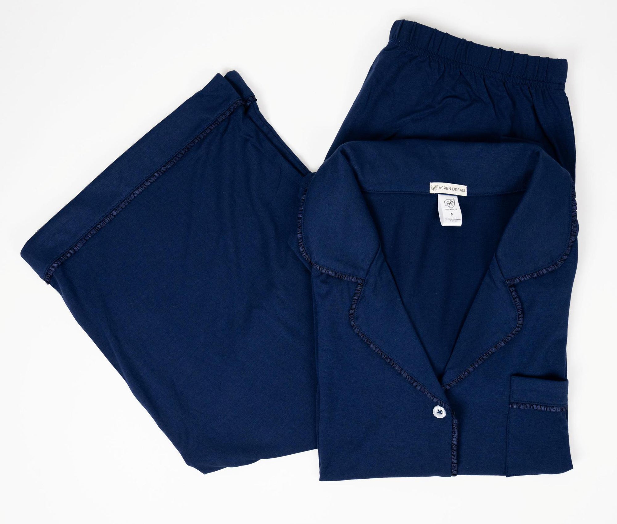 Flat lay of the Jolene Cropped Pajama Set in navy with button-down top and cropped pants