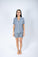 Model wearing Jolene Short Pajama Set in Night Owl with short sleeves, button-down top, and mid-rise shorts.