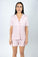 Model wearing the Jolene Short Pajama Set in rose powder with short sleeves and mid-rise shorts