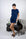 Model wearing Navy lounge short set with rolled sleeve top and drawstring shorts