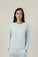 Model wearing Ice Blue long sleeve top with relaxed fit and soft bamboo fabric
