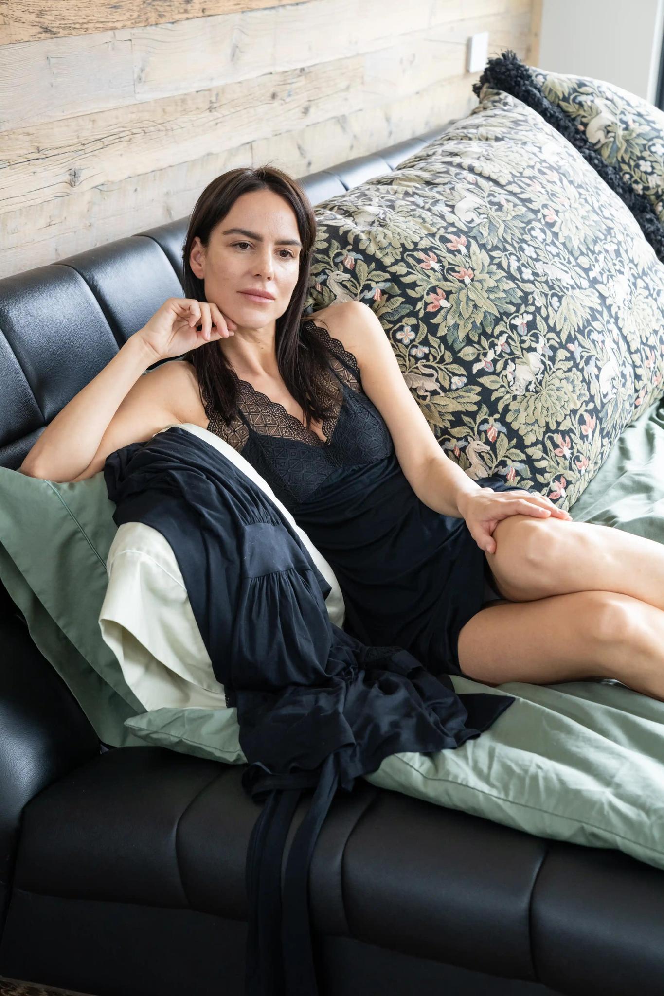 Model wearing Nora Racerback Chemise in Black with lace panels and flattering fit