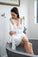 Model wearing Nora Racerback Chemise in Ivory with lace detail and smooth bamboo fabric