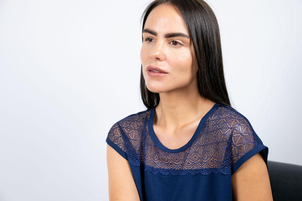 Close-up of delicate lace panel on the navy bamboo T-shirt from the Nora loungewear set