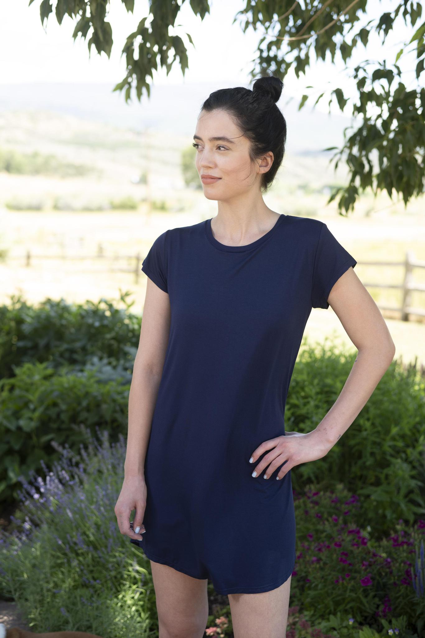 Model wearing navy Restless Lounger Dress with built-in shelf bra and relaxed bamboo silhouette