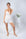 Model wearing rosewater ribbed cami lounge set with built-in shelf bra and matching shorts