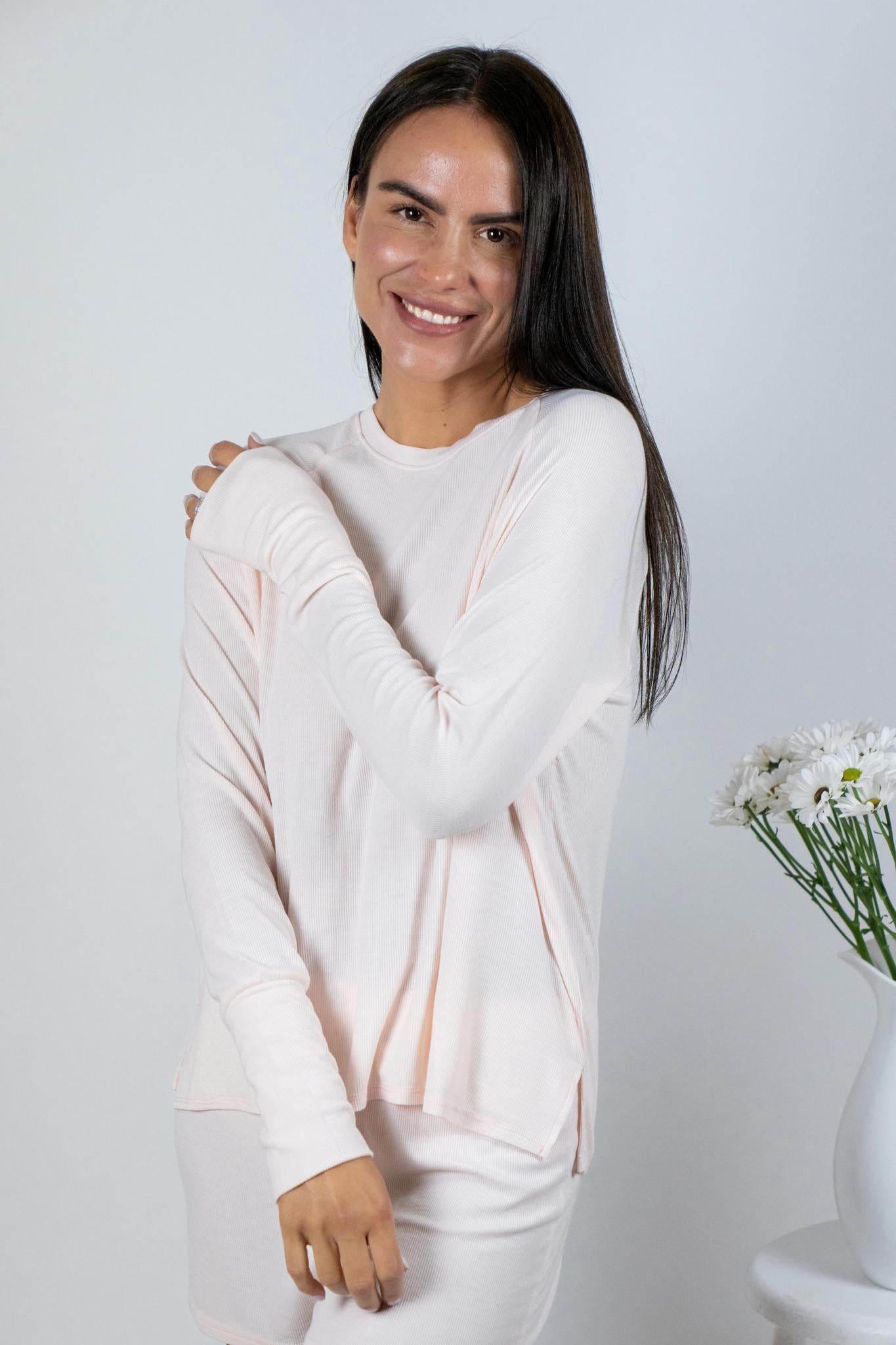 Model wearing rosewater ribbed long sleeve bamboo top with relaxed fit