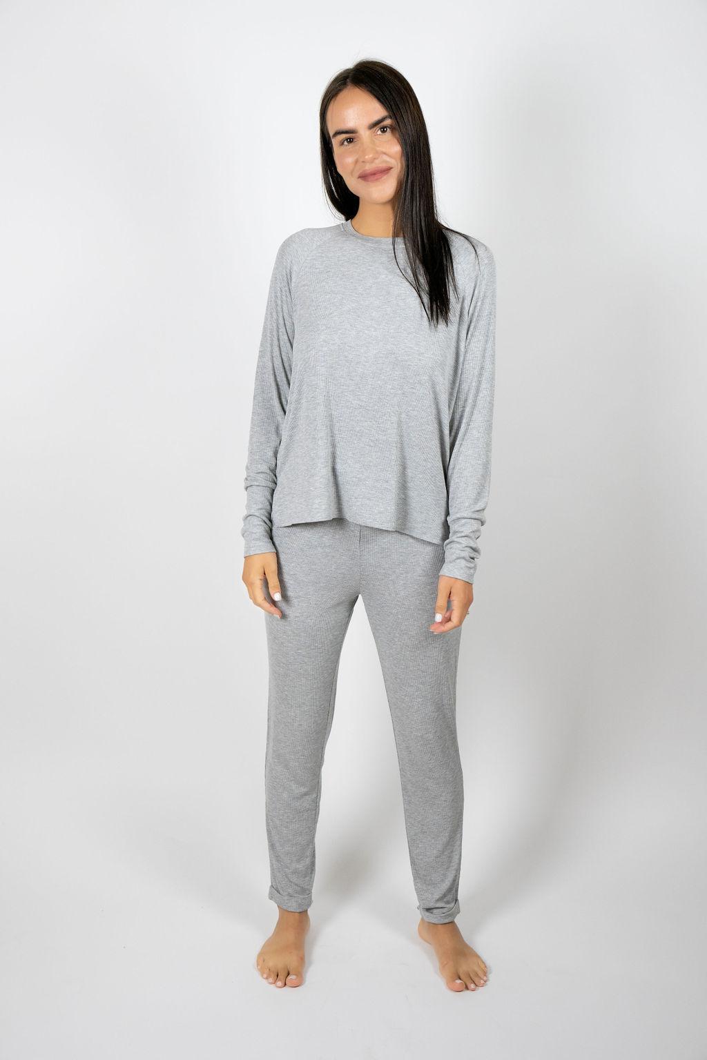 Model wearing silver ribbed long sleeve bamboo top with relaxed fit and round neckline, with matching joggers
