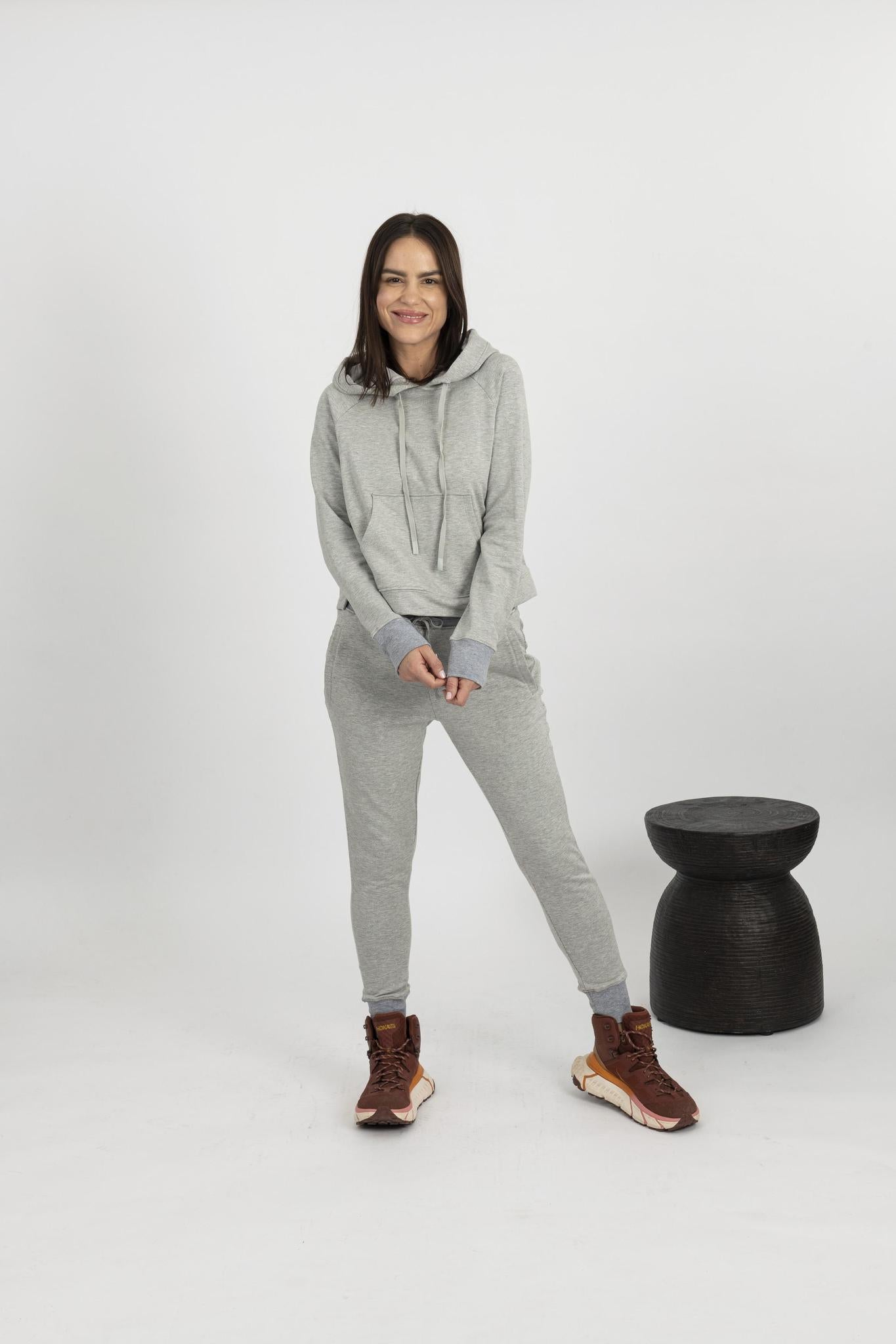 Model wearing heather gray Tatum track suit with hooded top and drawstring jogger pants