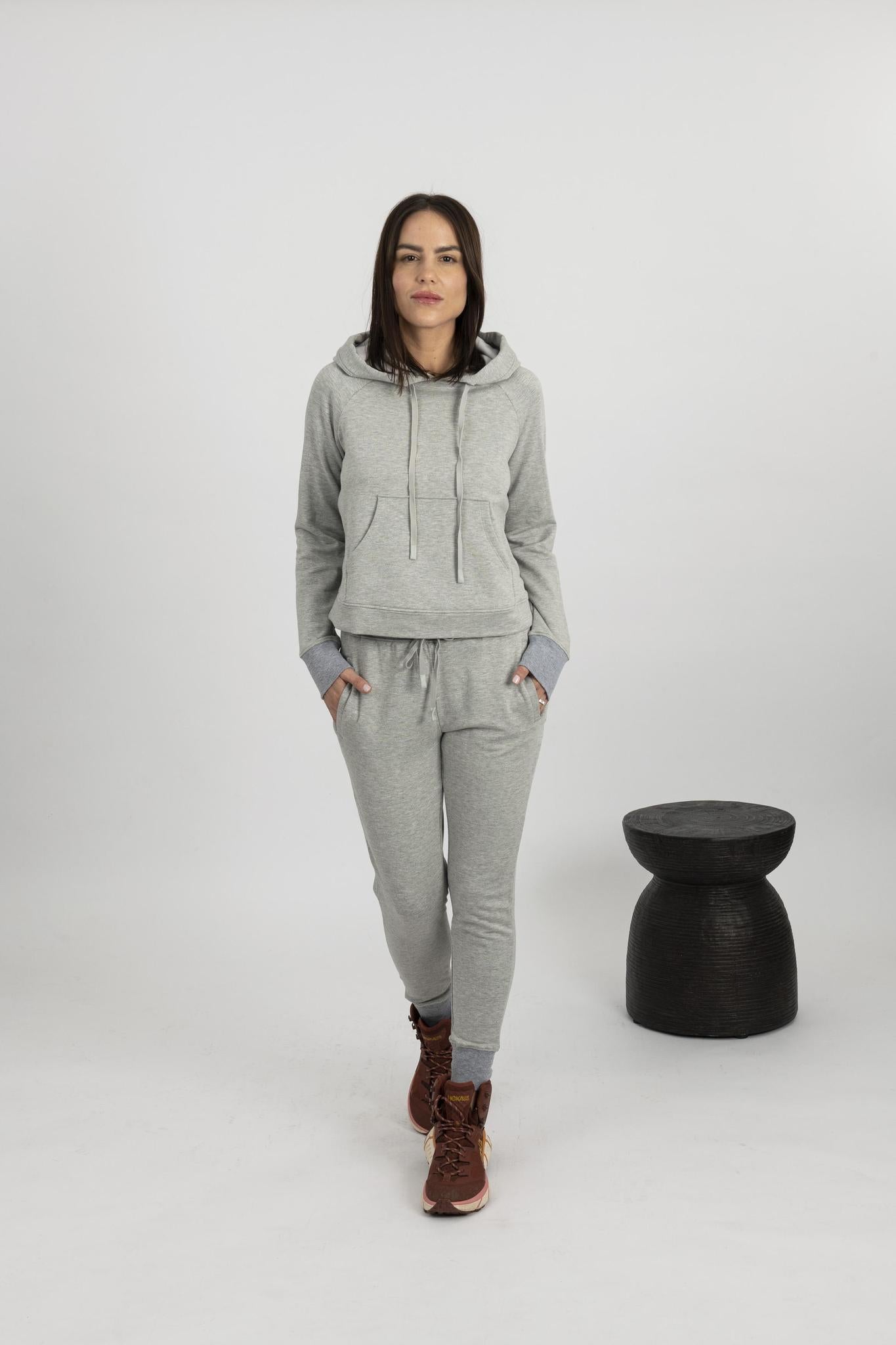 Model wearing heather gray Tatum track suit with hooded top and drawstring jogger pants