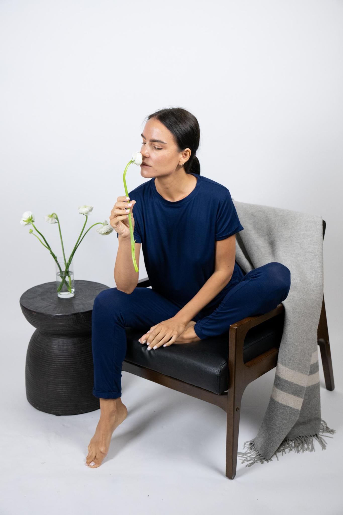 Model wearing the Taylor Rolled Sleeve T-Shirt in Navy, relaxed fit and modern rolled sleeves, with matching navy joggers