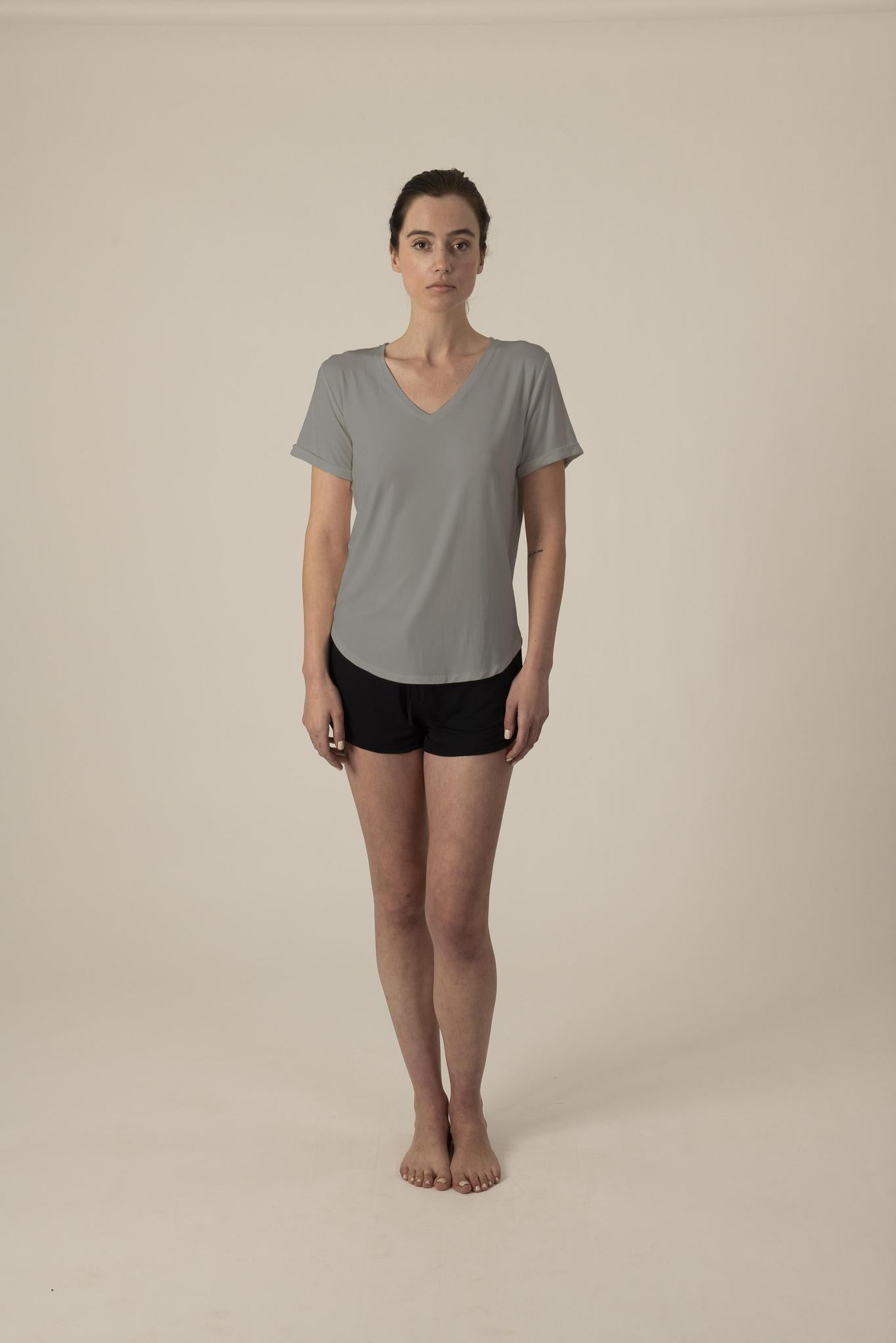 Model wearing gray V-neck T-shirt with semi-fitted cut and short sleeves