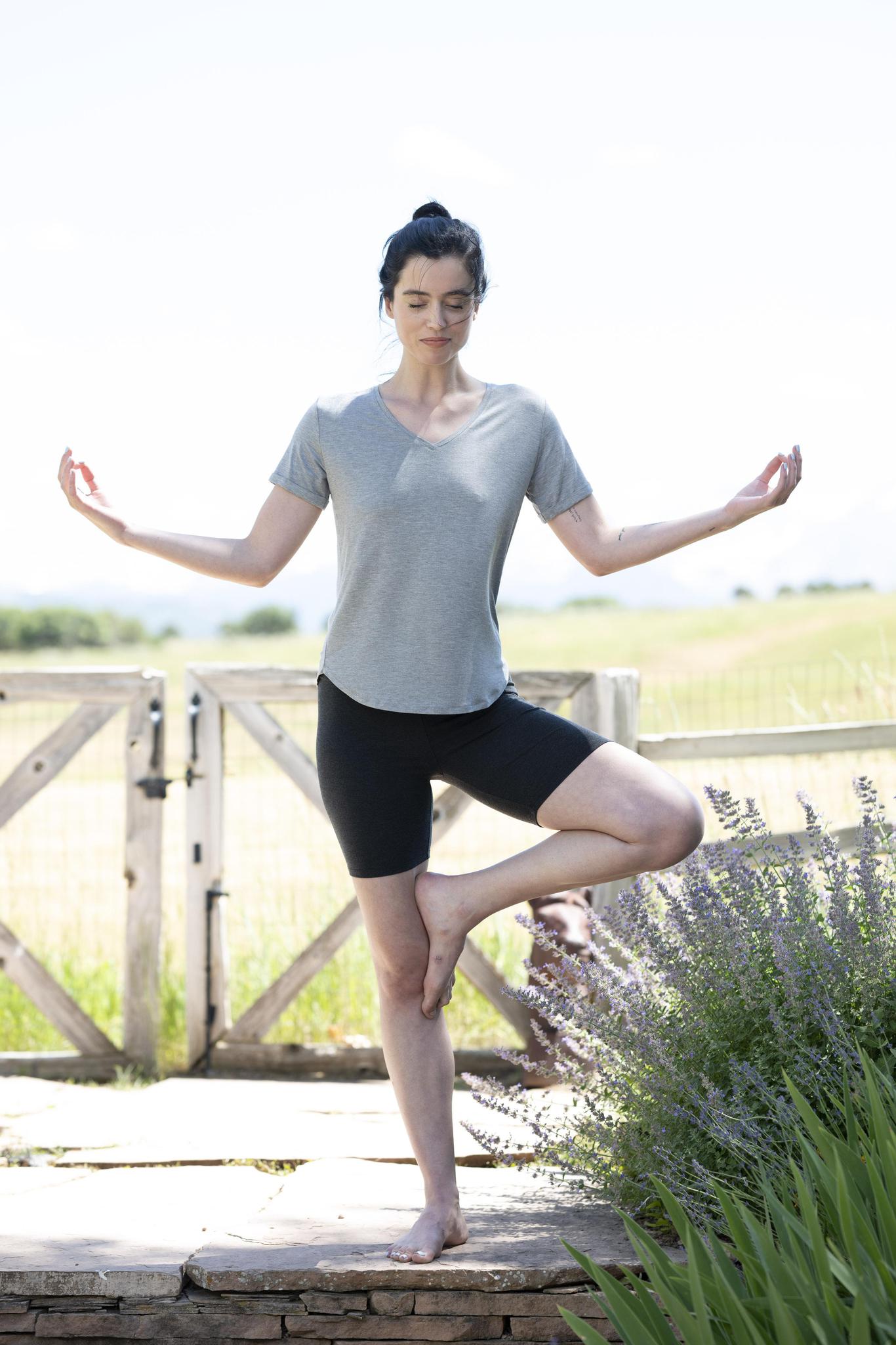 Model wearing gray V-neck T-shirt with semi-fitted cut and short sleeves