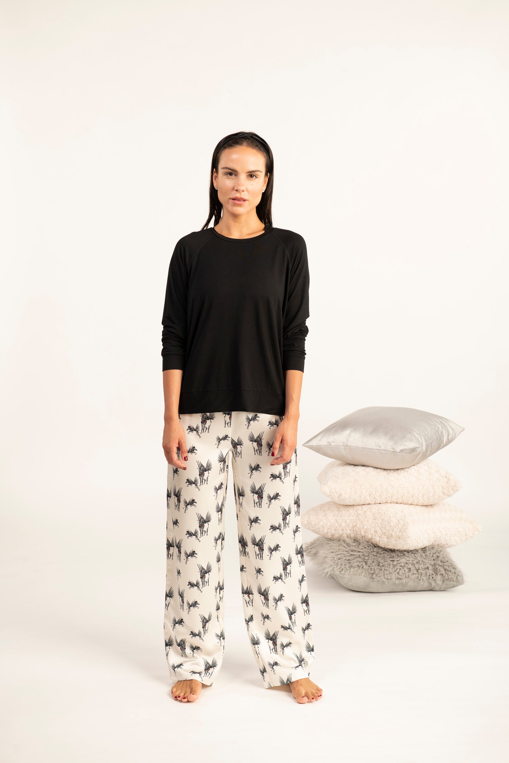 Model wearing Miley long sleeve top in black with relaxed fit and crew neckline