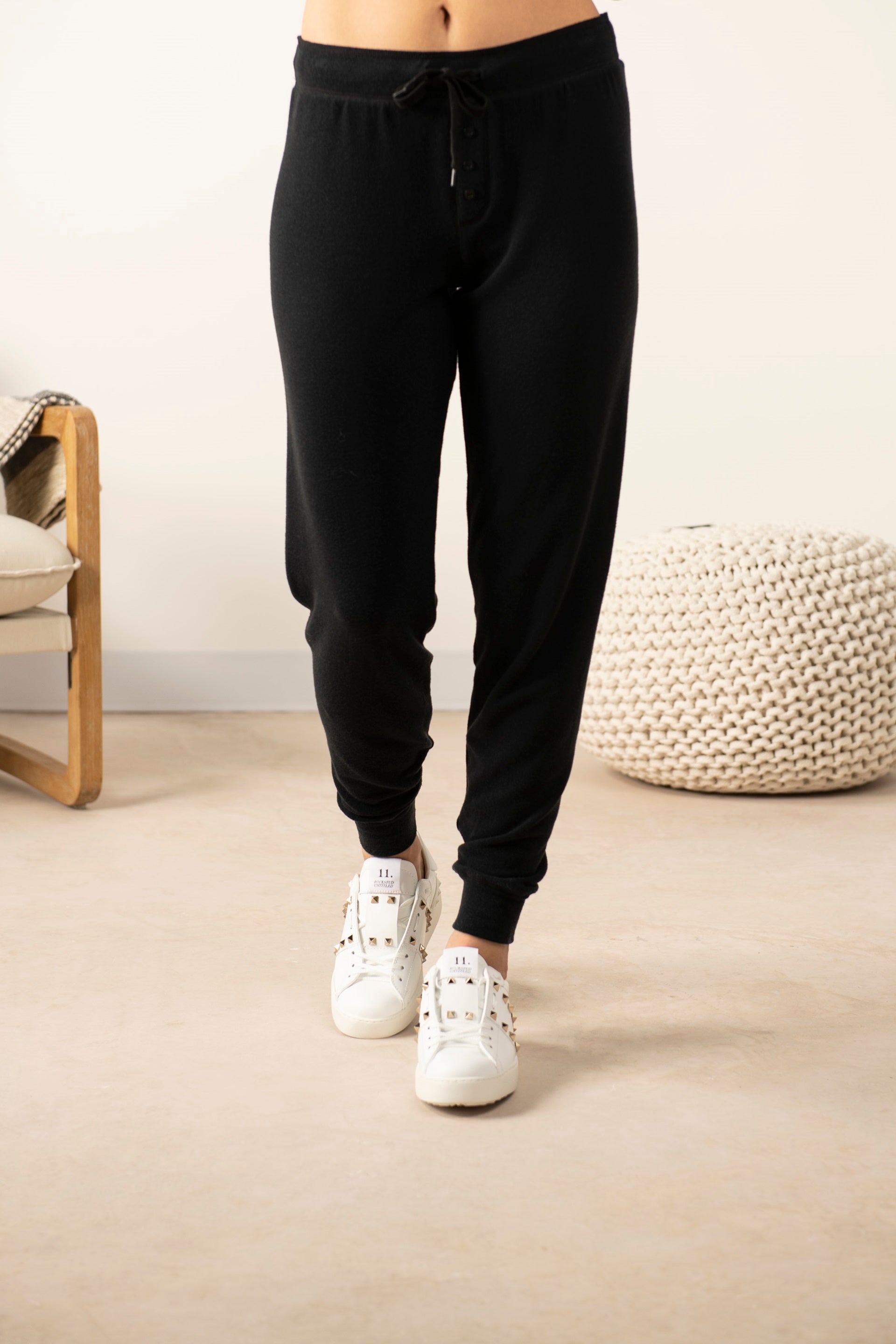 Model wearing the Cozy Banded Joggers in black, relaxed fit, tapered leg, and adjustable drawstring waist.