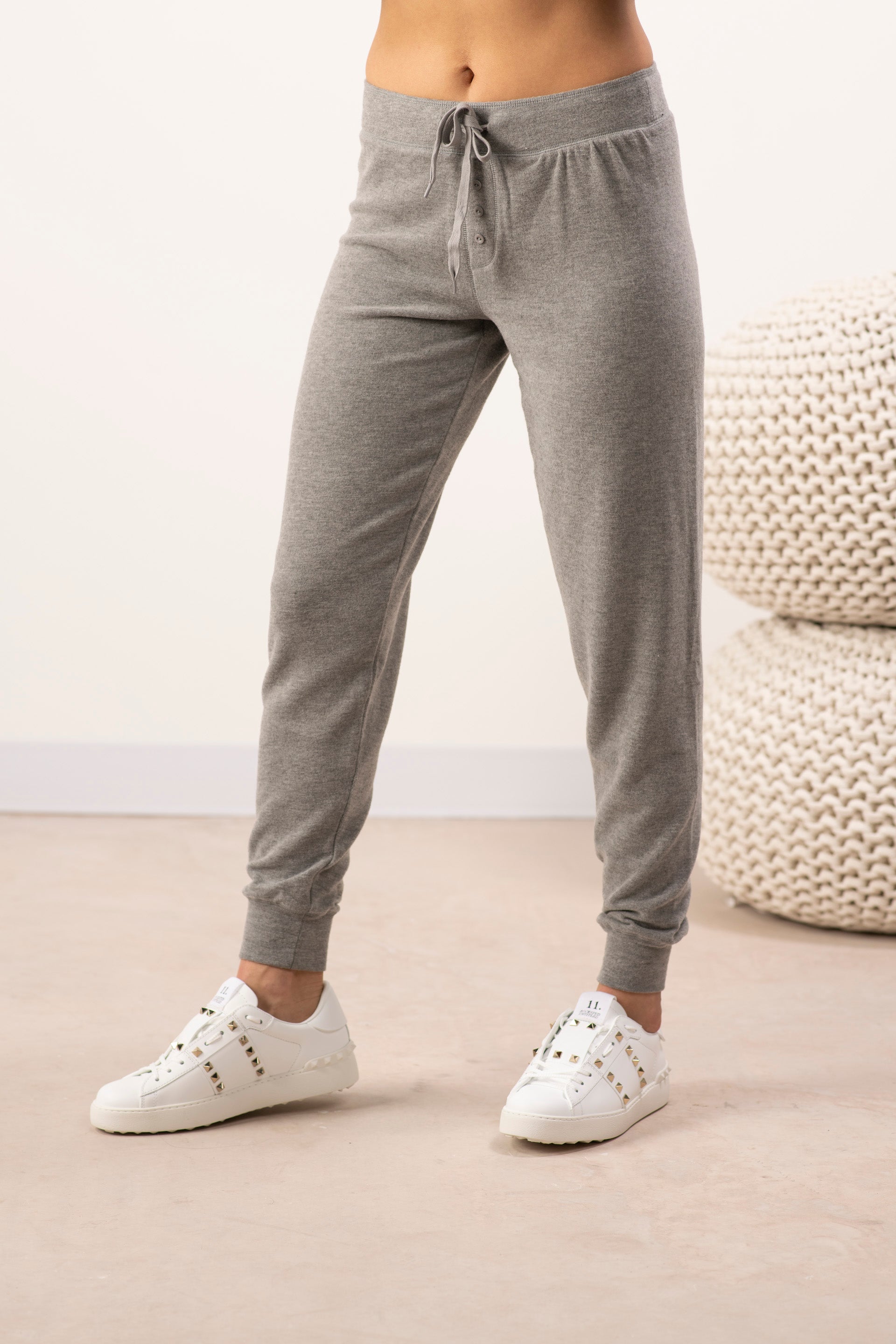 Model wearing the Cozy Banded Joggers in Heather Gray, relaxed fit, banded cuffs, and adjustable drawstring waist.