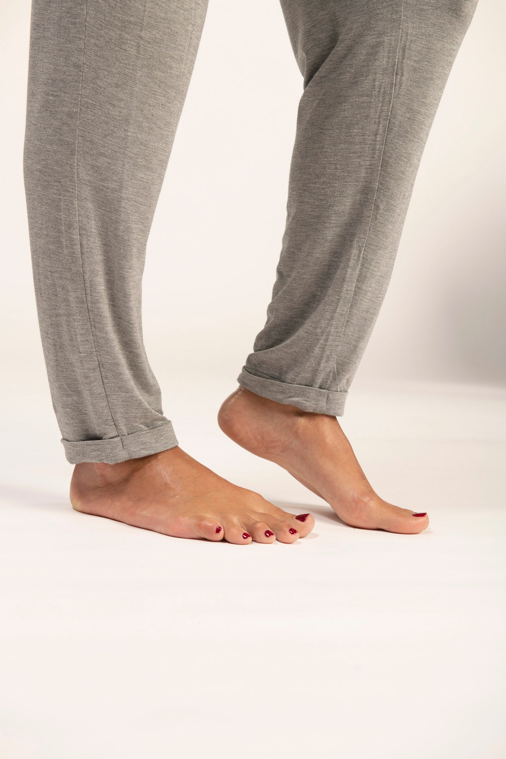 Close-up of tapered cuffs on heather gray lounge joggers.