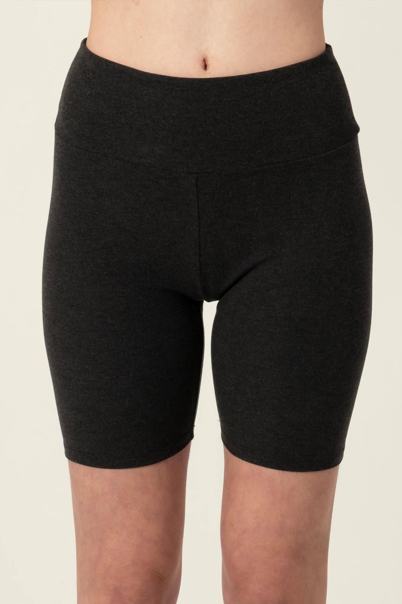 Model wearing Comfy Bike Shorts in Graphite with mid-thigh length and soft stretch fit.