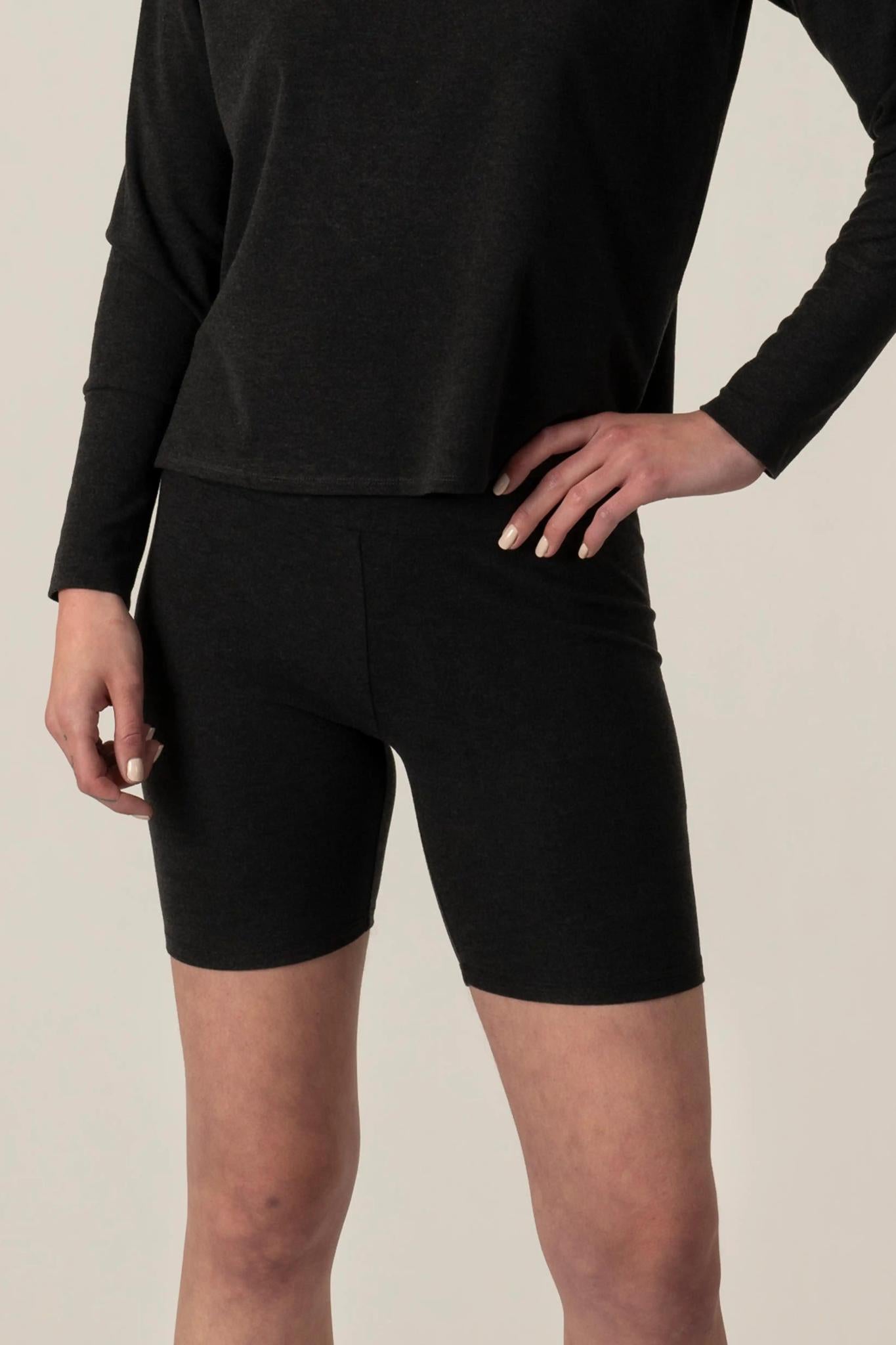 Model wearing Comfy Bike Shorts in Graphite with mid-thigh length and soft stretch fit.