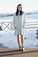 Model wearing Cozy Dress in Morning Blue with relaxed fit and side pockets.
