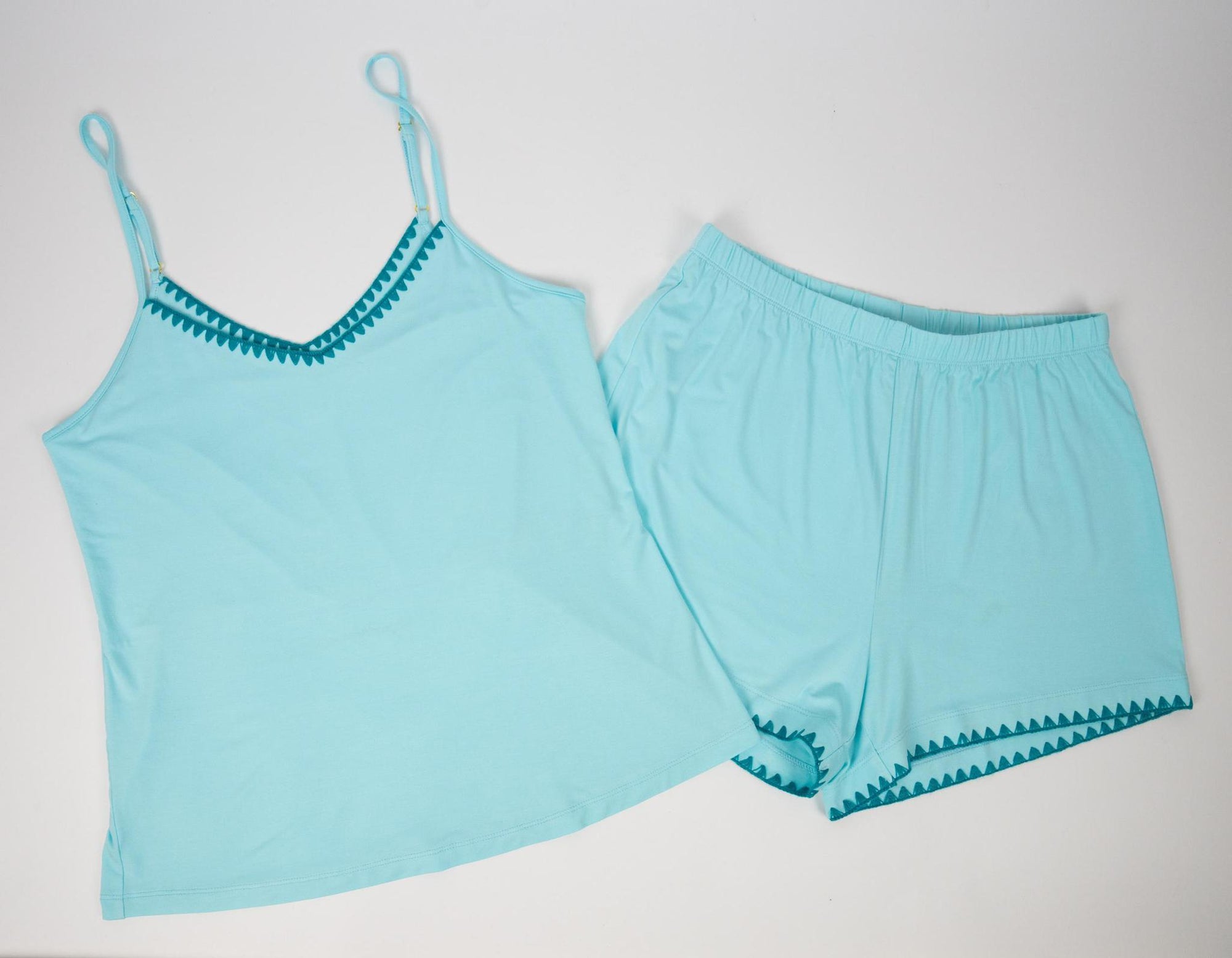 Flat lay of the Cute Stitching Cami Short Set in Antigua with contrast teal stitching and easy relaxed silhouette