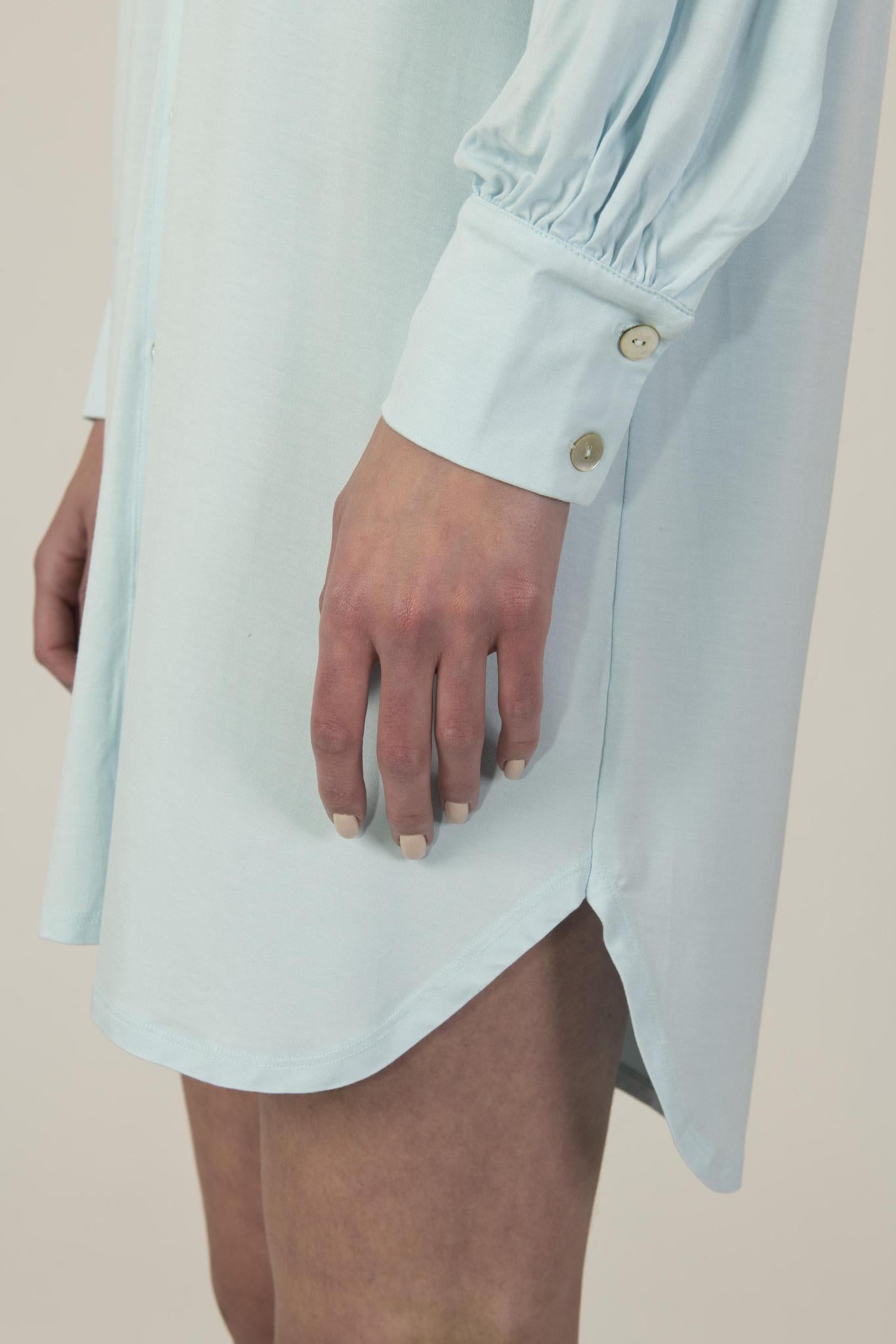 Close-up of gathered sleeve and mother-of-pearl button on Dahlia Nightshirt