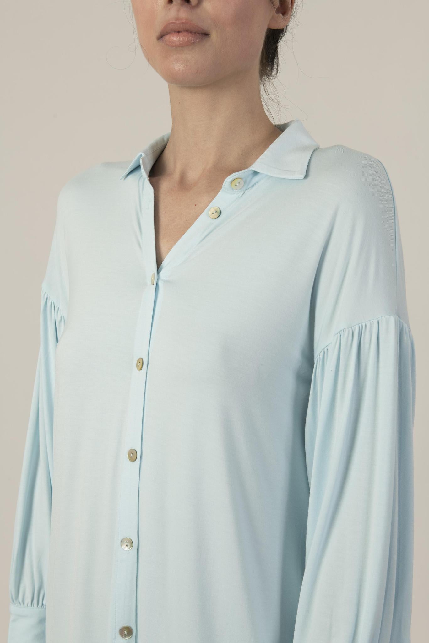 Close-up of gathered sleeve and mother-of-pearl button on Dahlia Nightshirt
