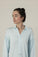 Model wearing the Dahlia Chic Nightshirt in Ice Blue with gathered neckline and button-down front