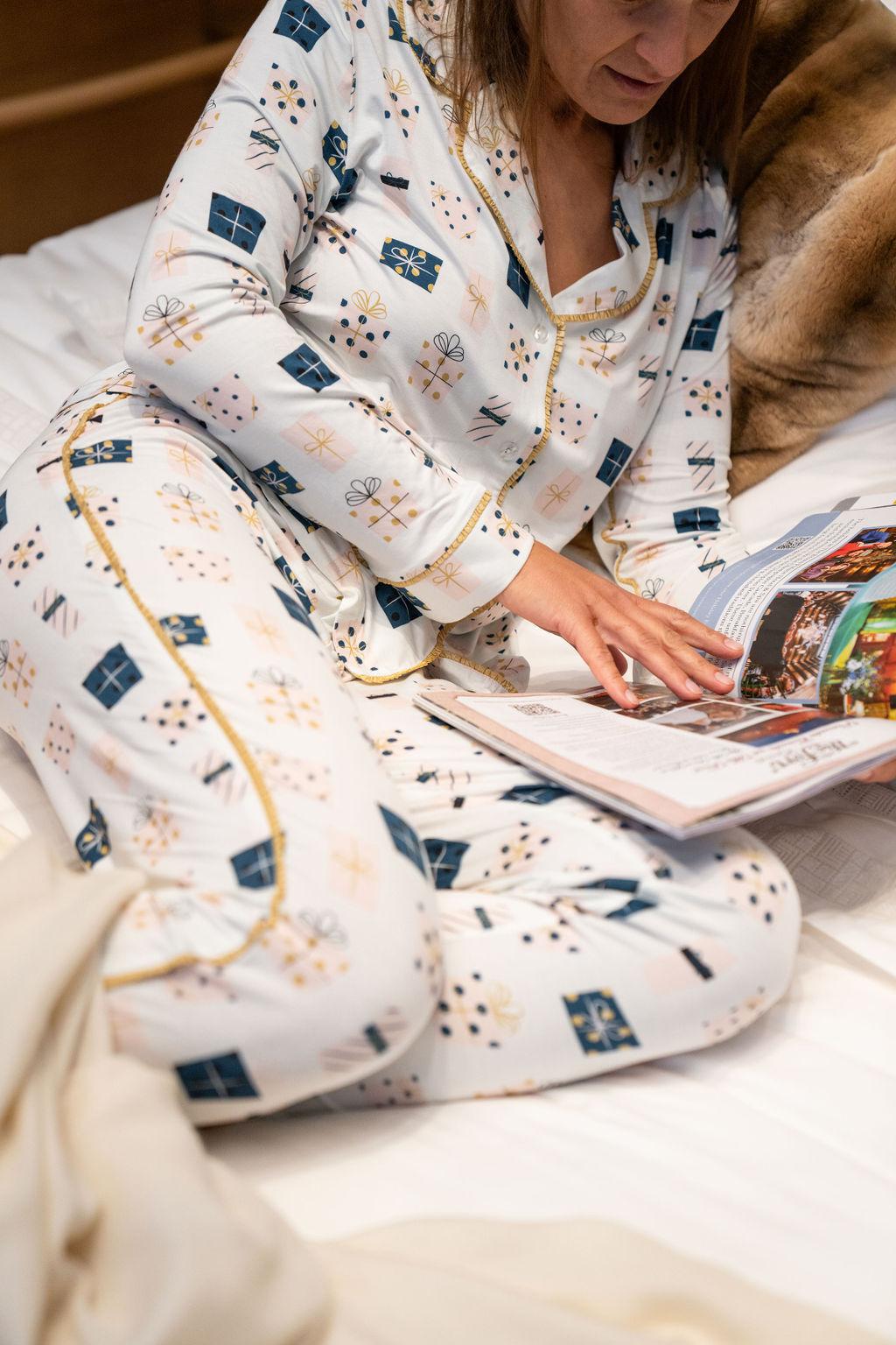 Model wearing the Mother’s Day Gift Print pajama set with hand-drawn gift boxes and ankle-length flared pants