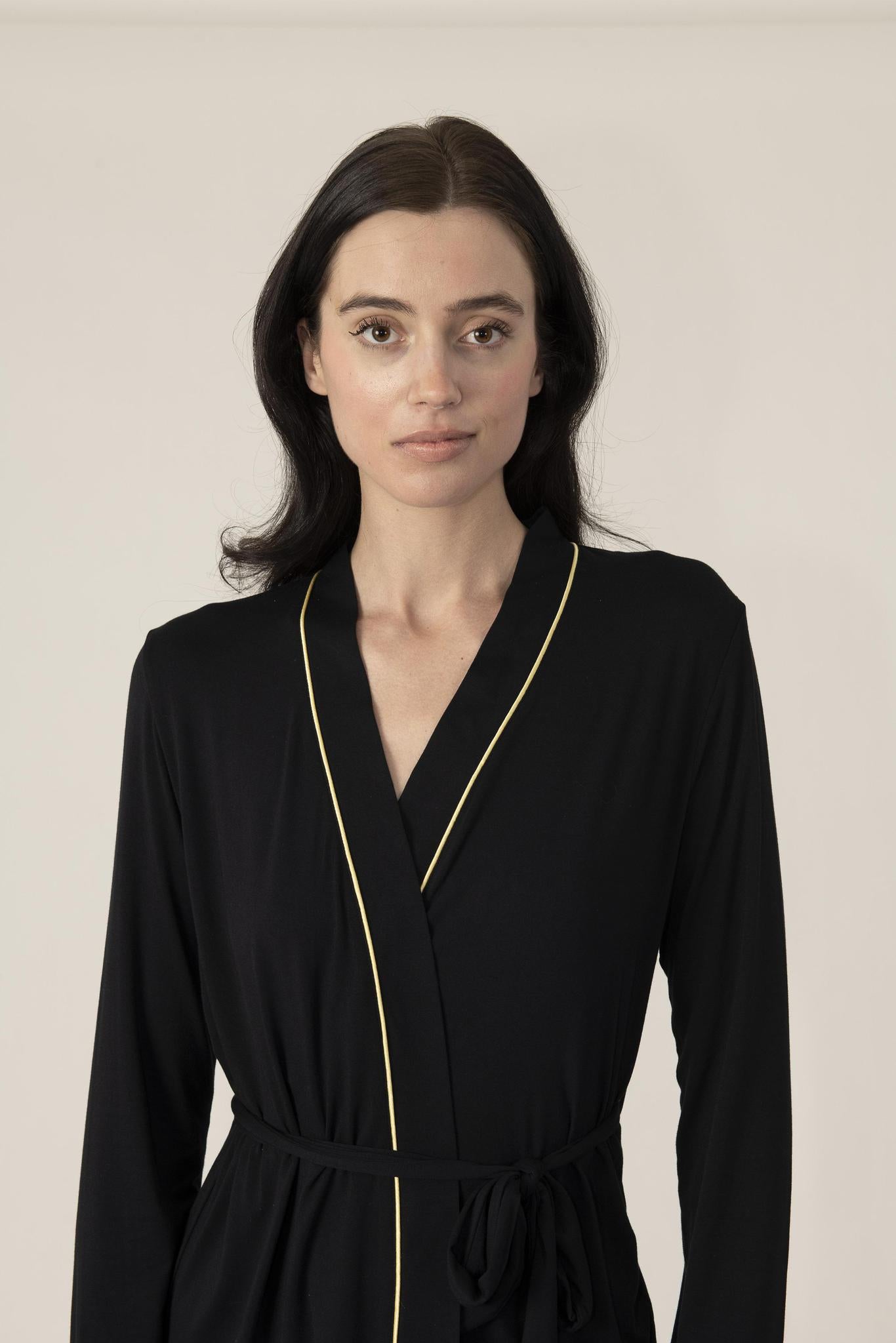 Close-up of gold accents on the Grand Queenie Pajama Set’s black feather-light fabric