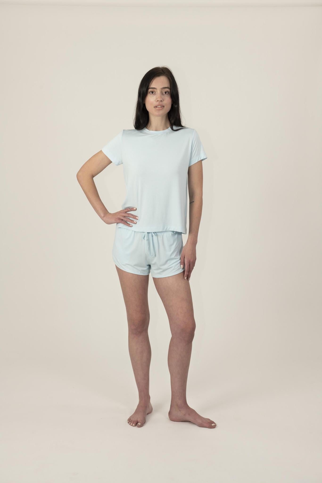 Model wearing Hang Out Track Shorts in Ice Blue with relaxed fit and drawstring waistband, with matching t-shirt