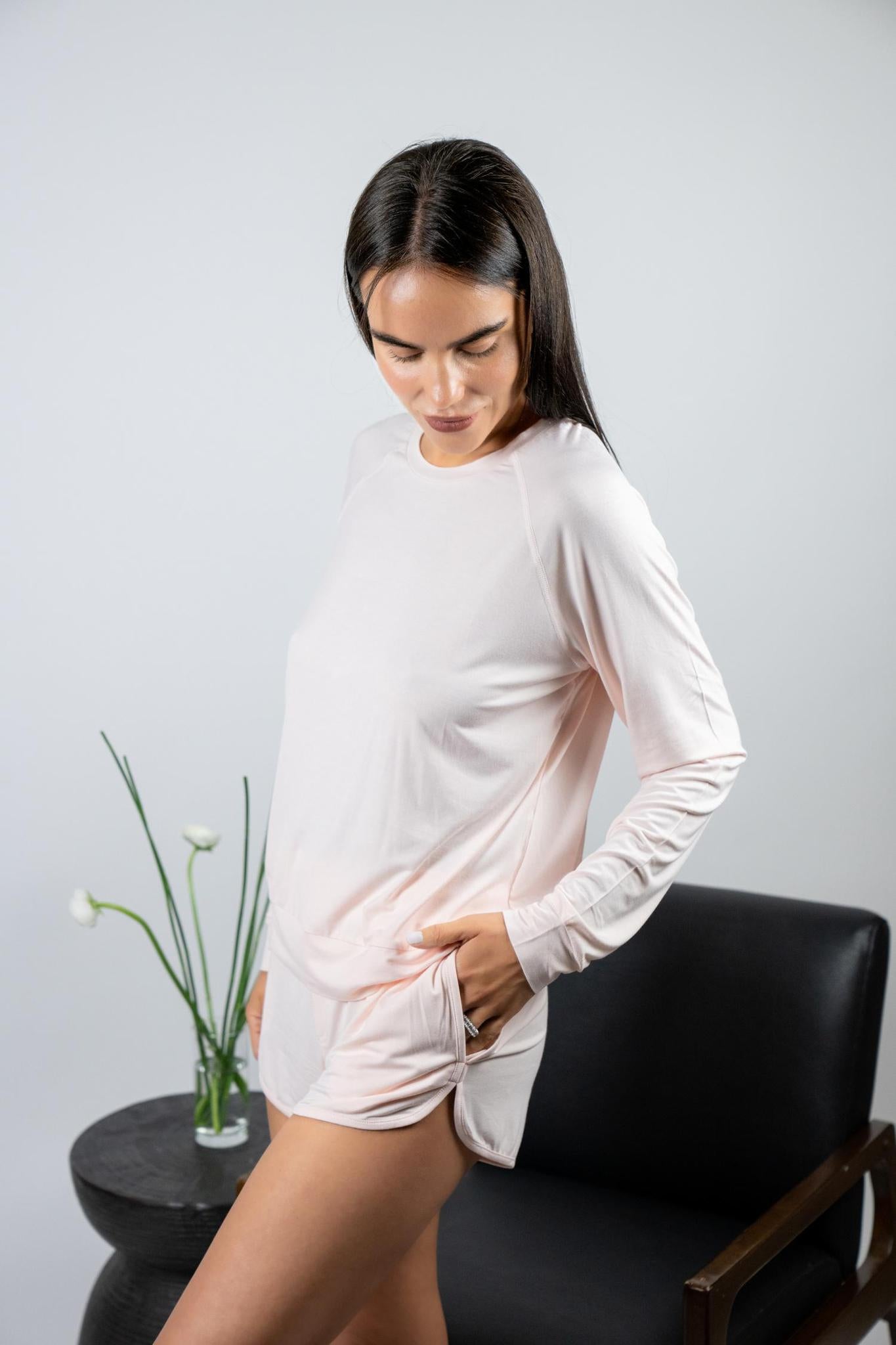 Model wearing Hang Out Track Shorts in Rosewater with relaxed fit and drawstring waistband, with matching long sleeve top.