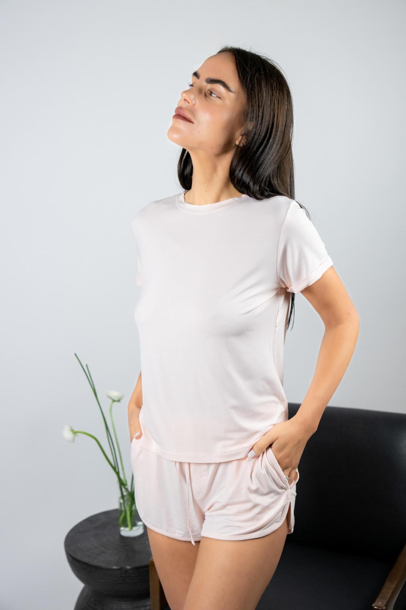 Model wearing Hang Out Track Shorts in Rosewater with relaxed fit and drawstring waistband, with matching t-shirt.