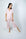 Model wearing Jolene Cropped Pajama Set in Powder Rose with short-sleeve button-down top and mid-rise cropped pants.