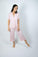Model wearing Jolene Cropped Pajama Set in Powder Rose with short-sleeve button-down top and mid-rise cropped pants.