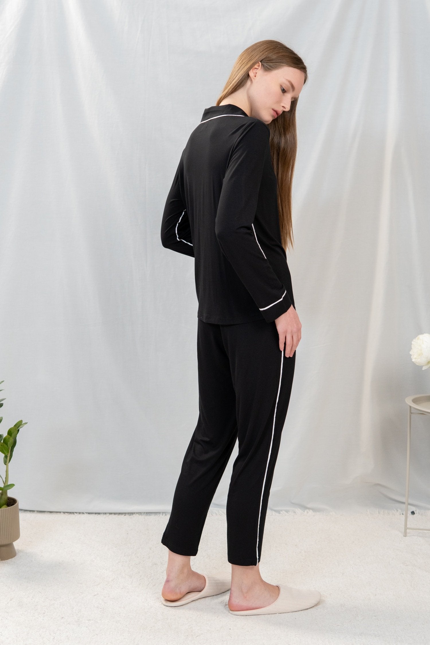 Back view of the Jolene Long Pajama Set in black showing the slim silhouette and relaxed fit