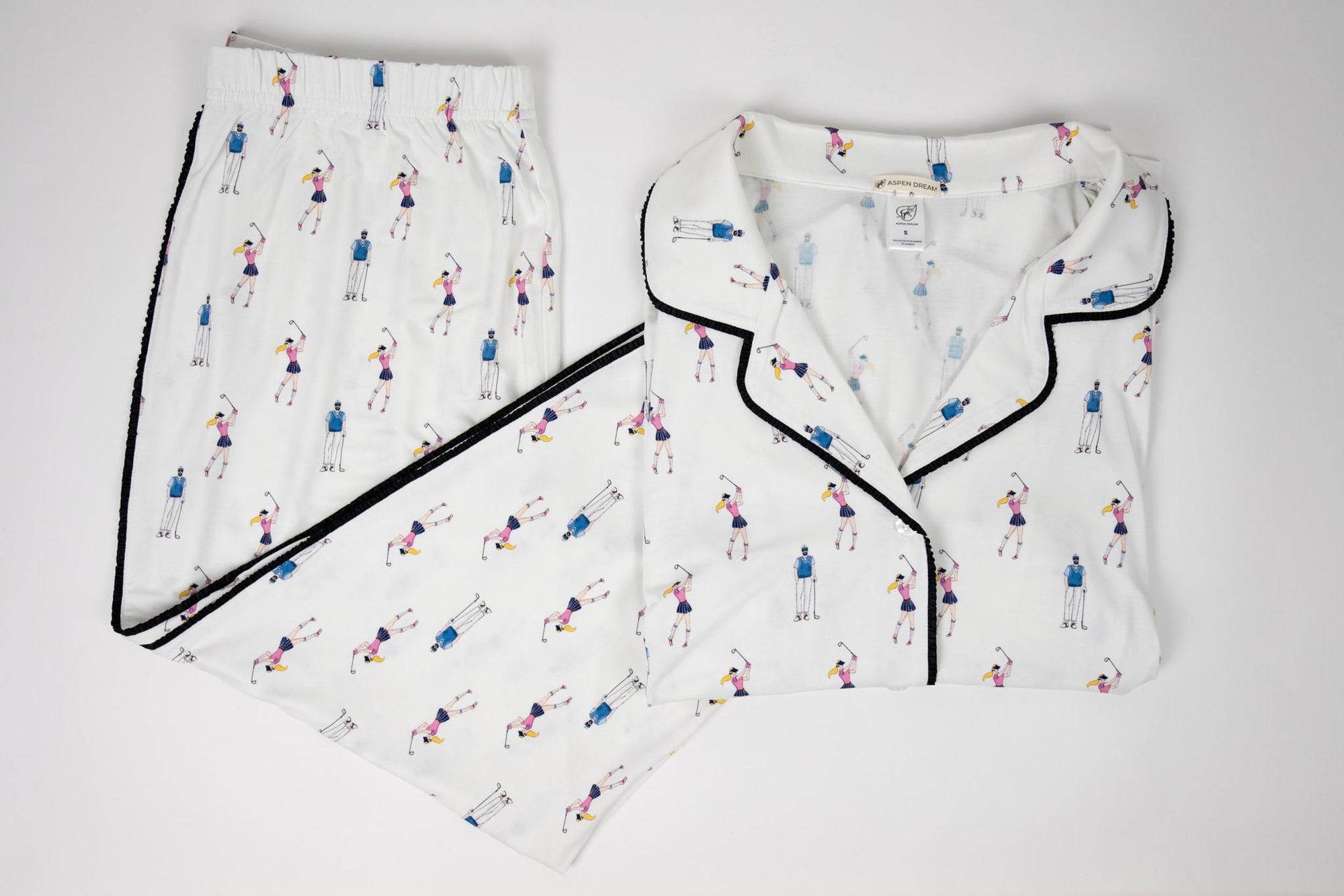 Flat lay of the Jolene Long Pajama Set in golf print with Japanese piping and flared ankle-length pants
