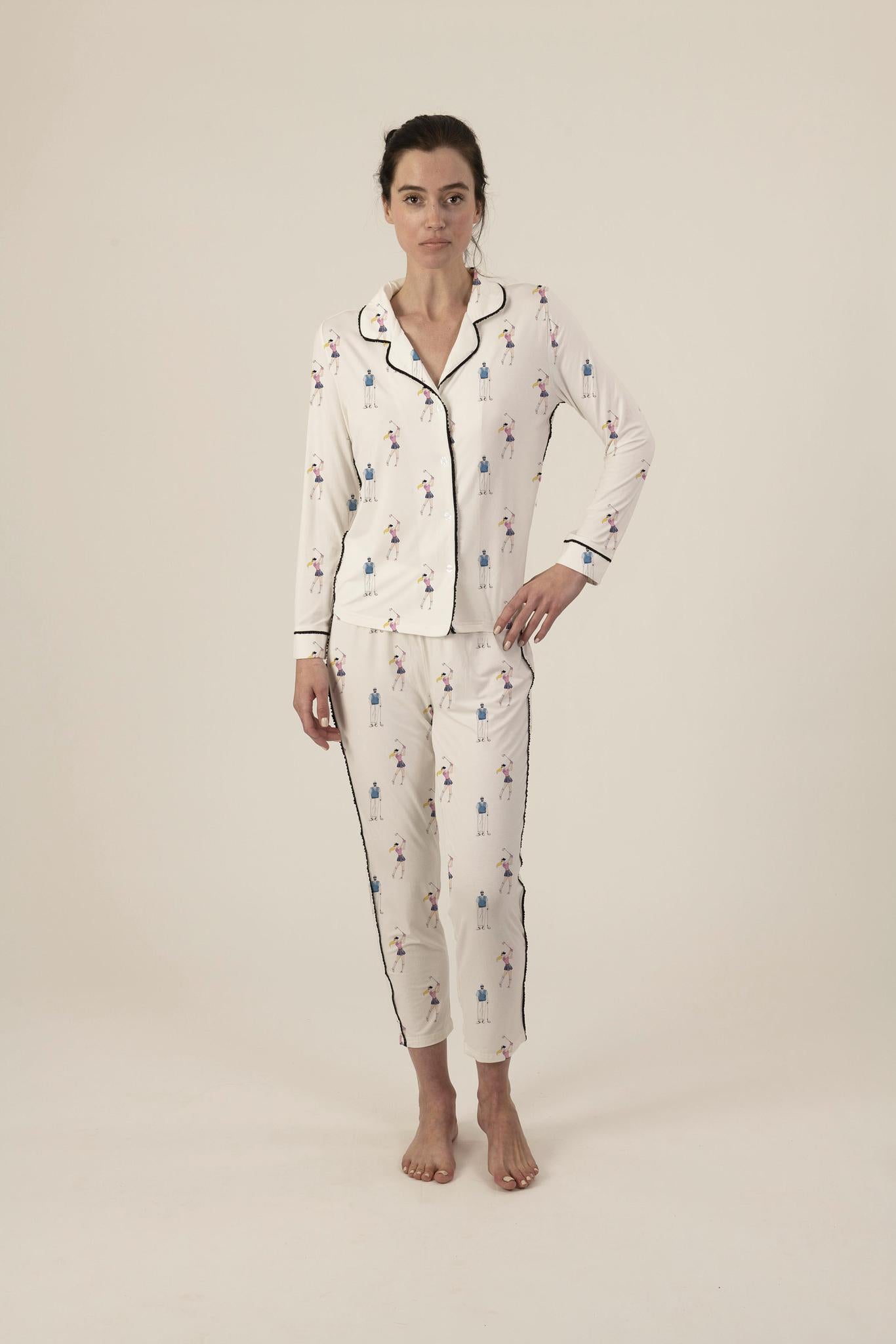 Model wearing Jolene Long Pajama Set with hand-drawn golf print, piped button-down top, and ankle-length flared pants