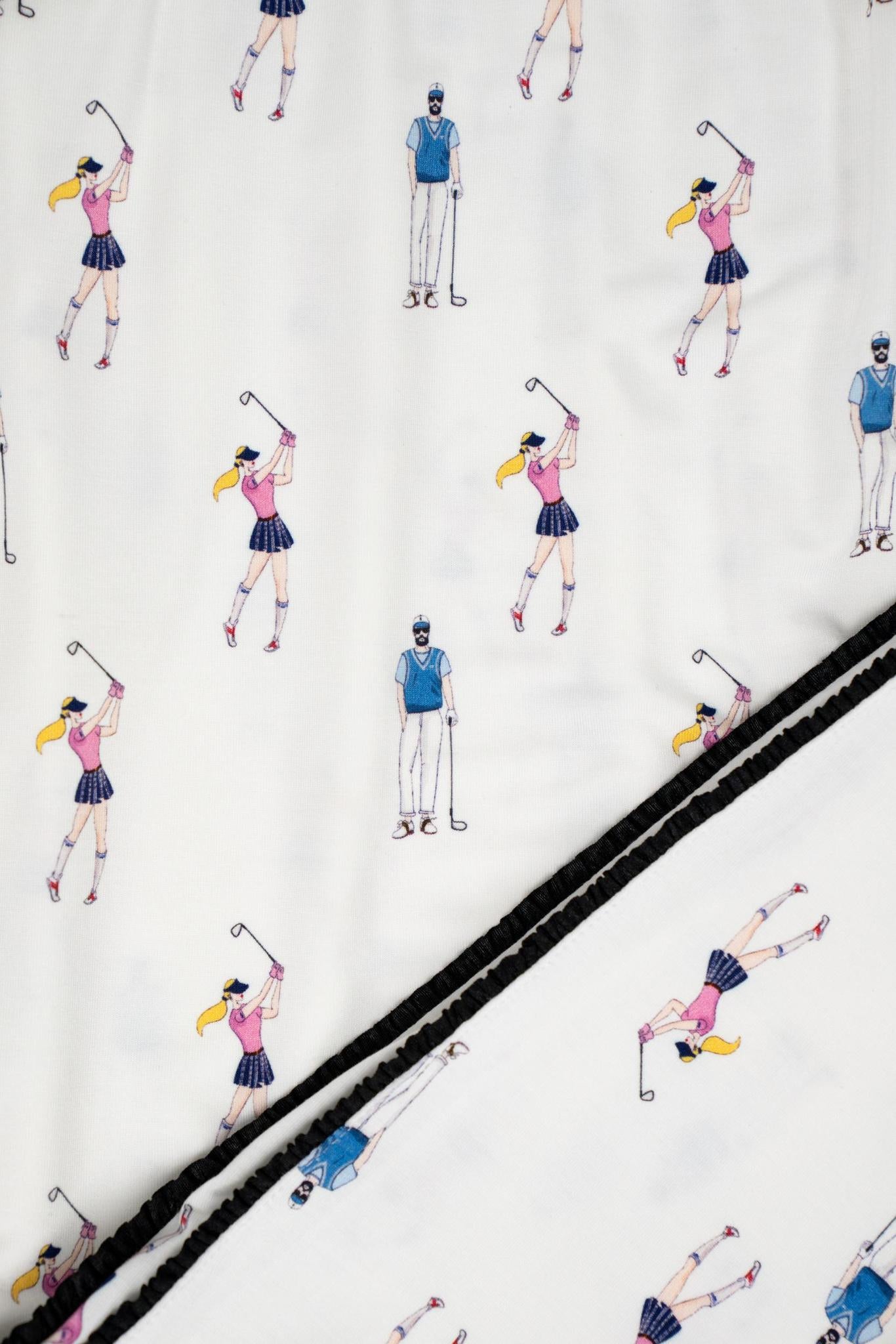 Close-up of Aspen-designed hand-drawn golf illustrations on ivory bamboo fabric